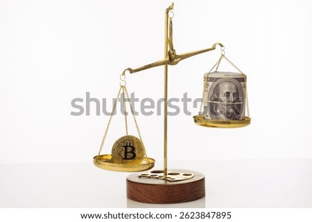 Bitcoin value increase trend. The coin outweighs the balance. On another bowl a stack of hundred dollar bills. White background - image
