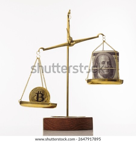 Bitcoin value increase trend. The coin outweighs the balance. On another bowl a stack of hundred dollar bills. White background - image