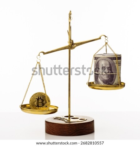 Bitcoin value increase trend. The coin outweighs the balance. On another bowl a stack of hundred dollar bills. White background - image