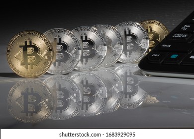 Bitcoins On The Reflective Marble Desk, Closeup. Cryptocurrency Virtual Money. Exchange, Anonymous. Bitcoin Is An Open Source Web Cash Currency.