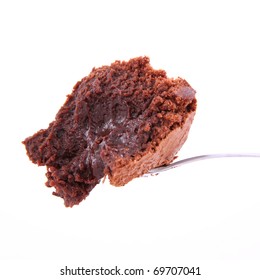 A Bite Of Brownie On A Spoon On A White Background