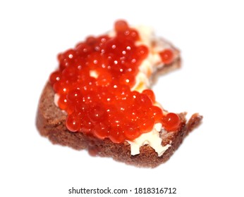 Bite Mark On The Surface Of A Sandwich Made Of Dark Bread And Red Caviar