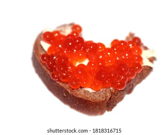 Bite Mark On The Surface Of A Sandwich Made Of Dark Bread And Red Caviar