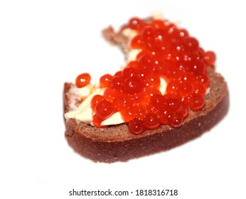 Bite Mark On The Surface Of A Sandwich Made Of Dark Bread And Red Caviar