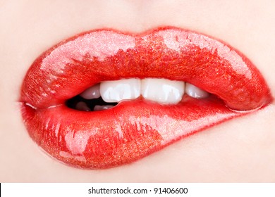 Biting her red lips teeth