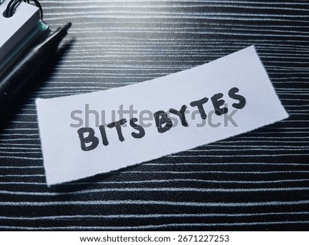 Bits bytes writting on table background. 