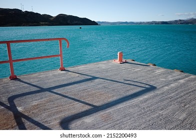 Bitt on pier at Lake Lago General Carrera, Puerto Ibanez, Aysen Province, Patagonia, Chile. Corner of pier for mooring boats on navigable glacial lake with clear bright blue water in Chilean Patagonia