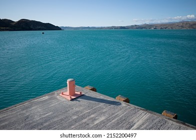 Bitt on pier at Lake Lago General Carrera, Puerto Ibanez, Aysen Province, Patagonia, Chile. Corner of pier for mooring boats on navigable glacial lake with clear bright blue water in Chilean Patagonia