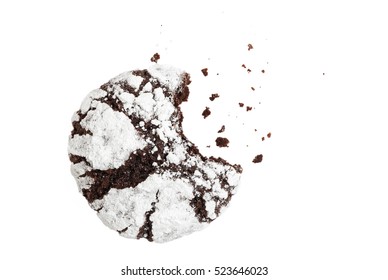 Bitten Homemade Chocolate Crinkle Cookie Powdered Sugar And Crumbs On White Background. Top View.