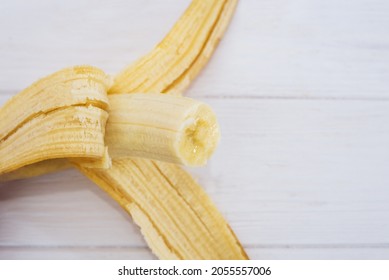 bitten off banana on a white background