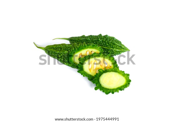 Bitter melon or bitter gourd\
isolated on white background with clipping path. Green fresh bitter\
melon or gourd is medicinal vegetable that prevent cancer.Cut\
out.