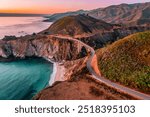 Bixby Bridge on Highway 1 and Big Sur along Pacific Ocean coast, beautiful landscape and aerial view, sunset, sunrise, fog. Concept, travel, vacation, weekend.