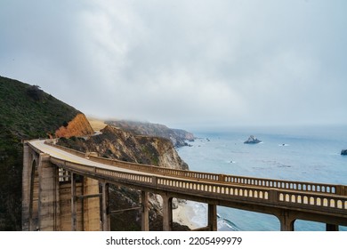 Bixby Creek Bridge Over Big Sur Cliffs And Pacific Ocean. Travelling On Highway 101 Wildlife Preservation