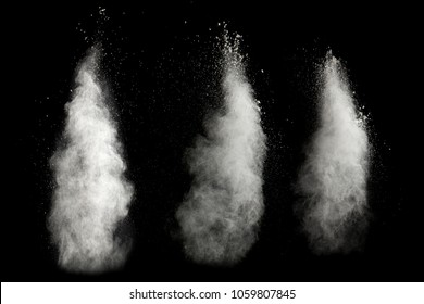 Bizarre forms of of white powder explosion cloud against dark background. Launched white particle splash on black background.