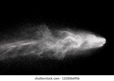 Bizarre forms of  white powder explosion against dark background. Launched white particle splashing.