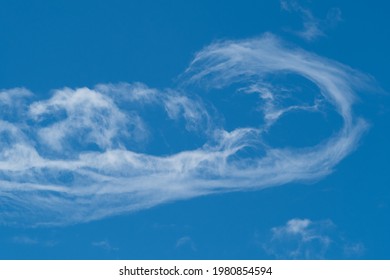 Bizarre white cloud in the blue sky