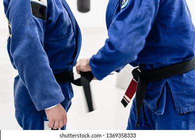 BJJ Brazilian Jiu JItsu Black Belt Promotion At The Academy Tying Up