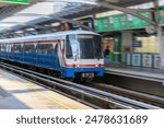 BKK BTS Bangkok Mass Transit System Sky train which is an elevated tram over the busy streets oh BKK Thailand 