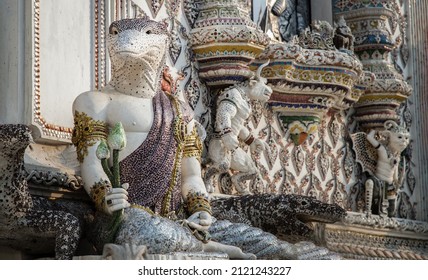 Bkk,Thailand.Feb-10,2022 : Elaborate sculptures of monster is made of bricks and mortar, decorated with various colored glazed tiles at the chapel of The Pariwas Ratchasongkram temple. Selective Focus
