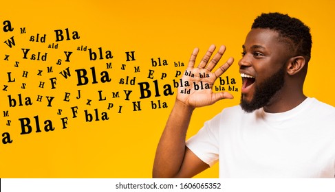 Bla Bla Bla. Handsome Black Guy Shouting At Copy Space, Making Announcement With Alphabet Letters Coming Out Of His Mouth, Yellow Background, Panorama