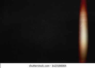 Black abstract background. Light effect. Instant photo. redacted. Foto film effect.  Lens flare and heavy grain. 70s