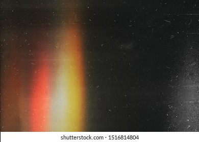 Black abstract background  Photo effect  Retro film wallpaper  Colorful abstract image  Grunge texture redaction  Lens flare   heavy grain 