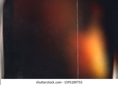 Black abstract background. Photo effect. Retro film wallpaper. Colorful abstract image. Grunge texture. redaction. Lens flare and heavy grain. - Shutterstock ID 1595189755