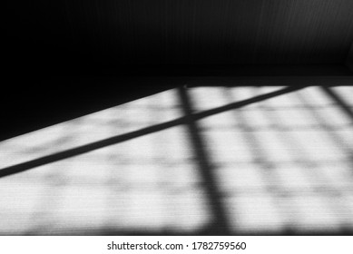 Black abstract lines, shadows on the wooden wall, floor