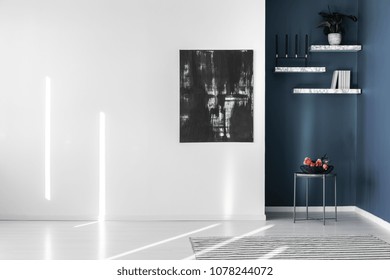 Black, Abstract Painting On An Empty, White Wall And Marble Shelves In A Corner Of A Contemporary, Minimalist Apartment Interior