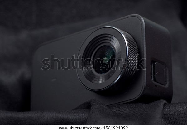 Black action\
camera on an isolated\
background