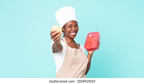 Black African American Adult Chef Woman With A Tupperware