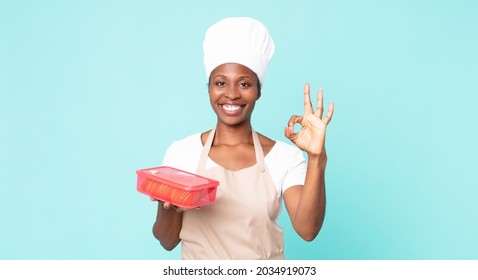 Black African American Adult Chef Woman With A Tupperware