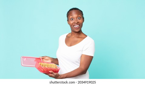 Black African American Adult Woman Holding A Tupperware