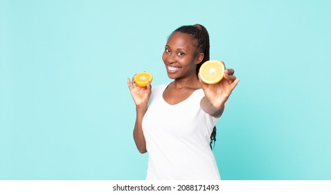 Black African American Adult Woman. Orange Juice Concept