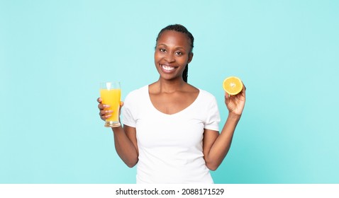 Black African American Adult Woman. Orange Juice Concept