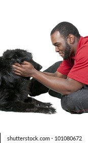 Black African American Man Playing With A Dog