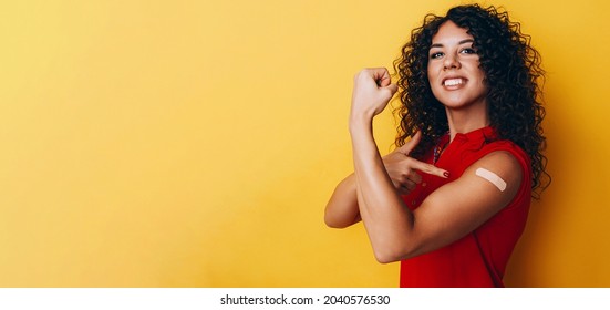 a black African American woman is vaccinated against covid and is very happy about it. the joy of having a vaccine made. - Shutterstock ID 2040576530