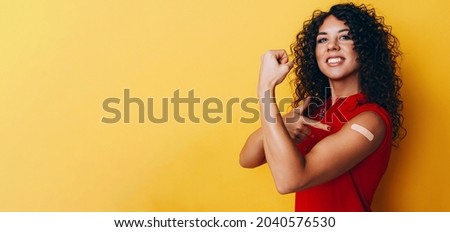 a black African American woman is vaccinated against covid and is very happy about it. the joy of having a vaccine made.