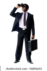 Black African Businessman Looking Ahead With Vision And Binoculars While Holding A Briefcase