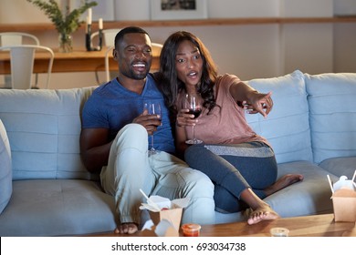 Black African Couple Watching Movie Television Together Having Date Night