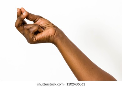 Black African female hand with brown skin is holding something or making a where's my money gesture with her right hand on isolated white background