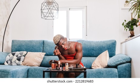 Black African Person Applying Makeup In Modern Living Room At Home