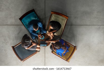 Black African Start Up Business Meeting Shot From Above. Overhead Business People In Brainstorming Discussion