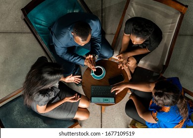 Black African Start Up Business Meeting Shot From Above. Overhead Business People In Brainstorming Discussion