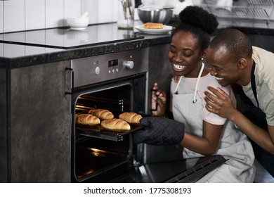 Black African Woman Shows Off What She Cooked In The Oven, Perfect Wife Cook For Their Family. Cooking, Baking Concept