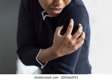 Black African Woman Suffers From Shoulder Joint Pain, Shoulder Stiffness Or Osteoporosis Or Having Pain At Injection Site As A Side Adverse Effect After Vaccination At Upper Arm Muscle