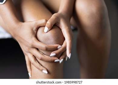 Black African Young Woman Having Knee Joint Pain Or Knee Injury Problem, Concept Of Knee Joint Surgery Or Orthopedics Treatment