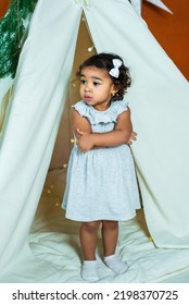 Black, African-american Girl Play In A Tent, Wigwam. Kid Is Sad And Scared. Baby Is Alone And Upset.