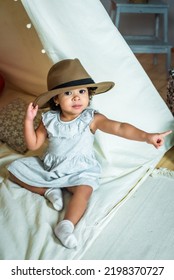 Black, African-american Girl Play In A Tent, Wigwam. Kid In A Hat Showing A Finger. Happy Childhood