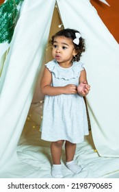 Black, African-american Girl Play In A Tent, Wigwam. Kid Is Sad And Scared. Baby Is Alone And Upset.